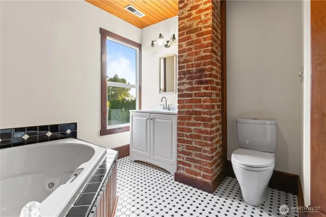 a bathroom with a tub and shower
