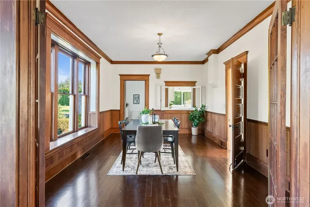 a dining room with furniture window wooden floor