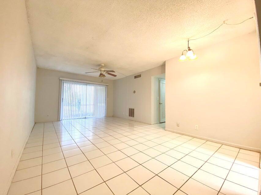 626 Northwest 13th Street, Unit 16 Boca Raton, FL 33486 - Photo 3 of 10 a view of an empty room and window