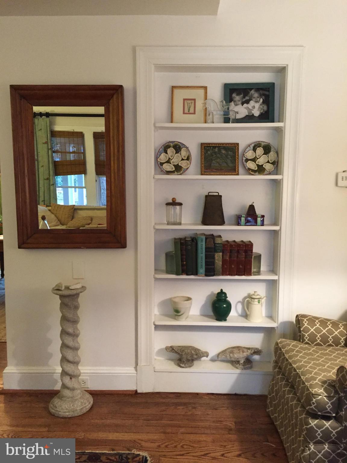 219 Hopkins Road Baltimore, MD 21212 - Photo 5 of 27 a living room with furniture and a book shelf