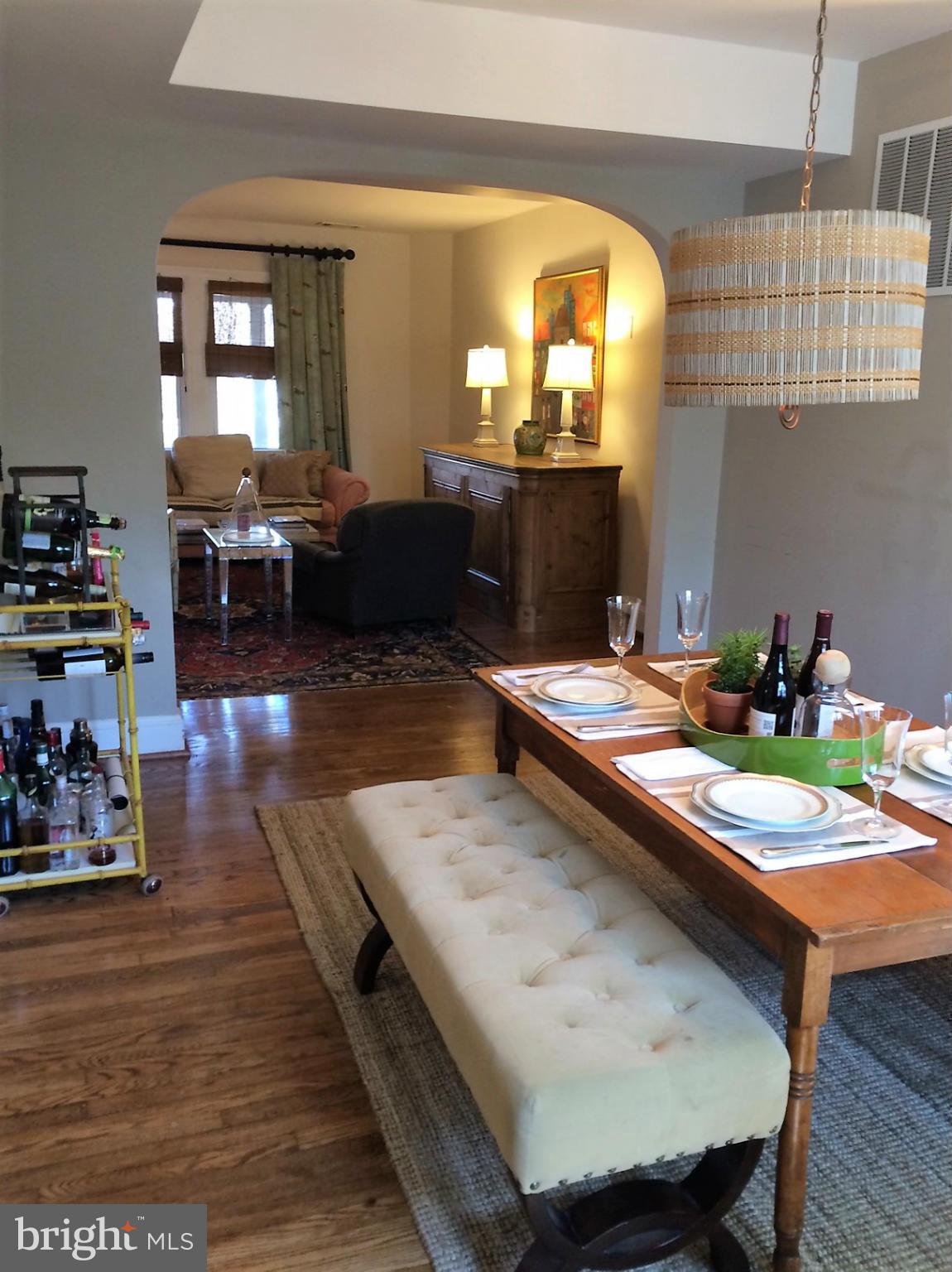 219 Hopkins Road Baltimore, MD 21212 - Photo 8 of 27 a kitchen with a table chairs and wooden floor