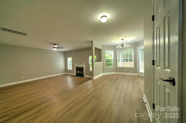 a large kitchen with kitchen island a sink stainless steel appliances and cabinets