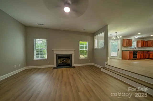 a kitchen with stainless steel appliances granite countertop a refrigerator sink and microwave