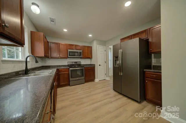 a view of gallery with wooden floor