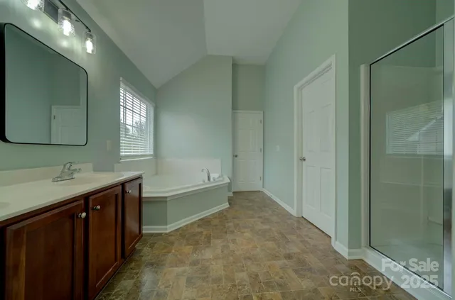 a bathroom with a bathtub and a sink