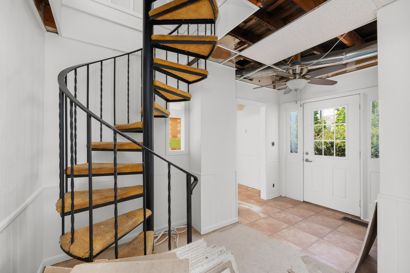 2416 7th Street Moline, IL 61265 - Photo 16 of 27 a view of staircase with white walls and a window
