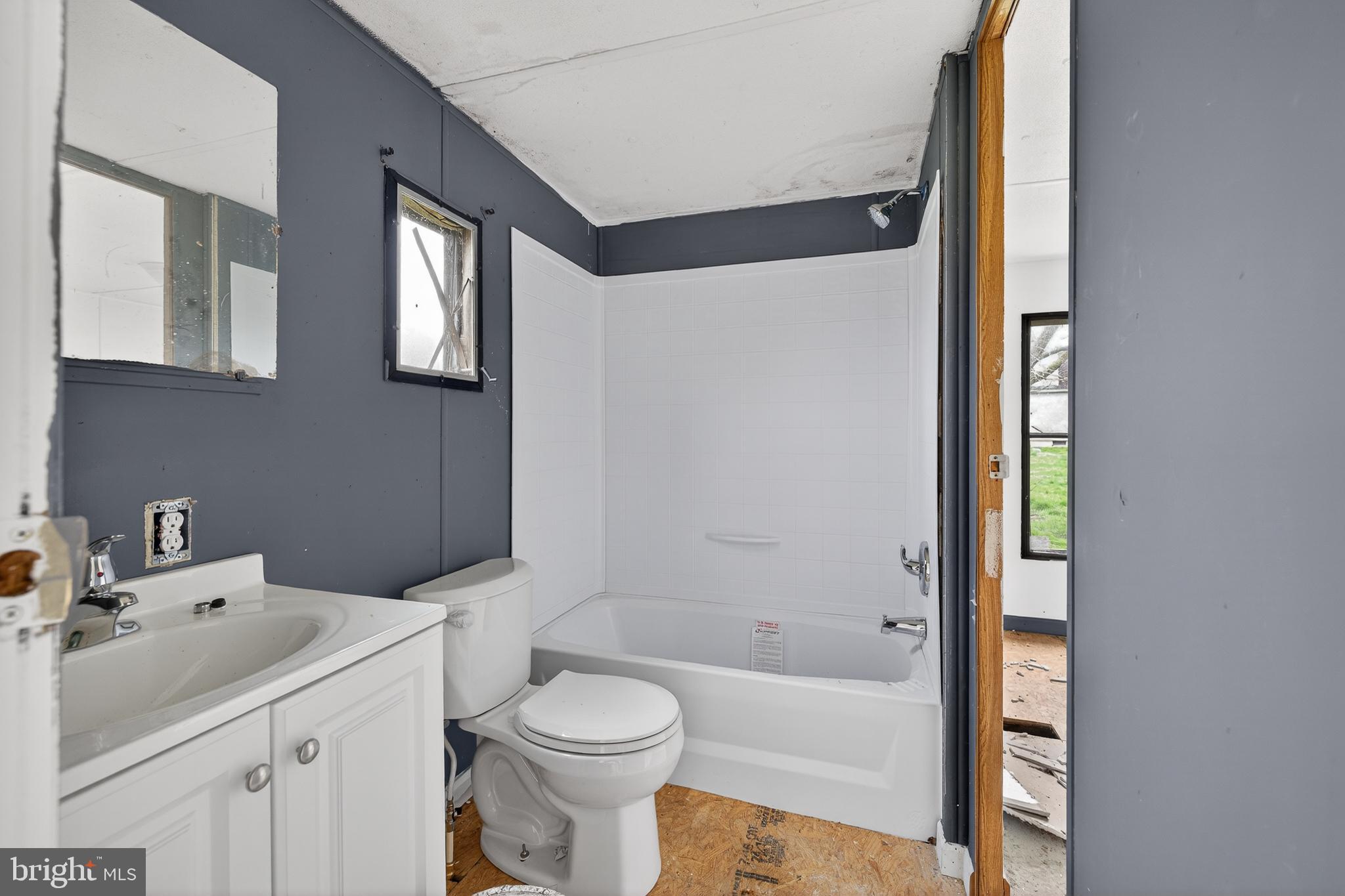2414 Arthursville Road Hartly, DE 19953 - Photo 26 of 45 a bathroom with a sink toilet and shower