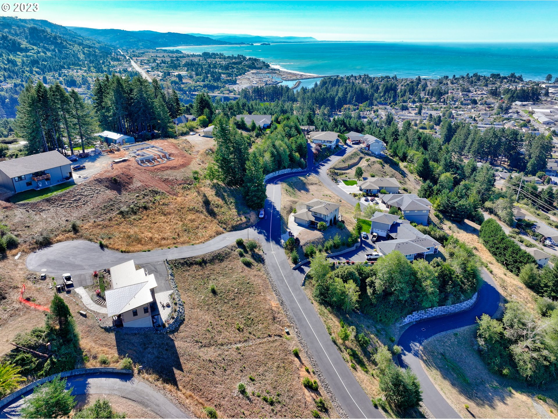 Pacific Terrace Drive Brookings, OR 97415 - Photo 11 of 14 an aerial view of a house with garden space and ocean view