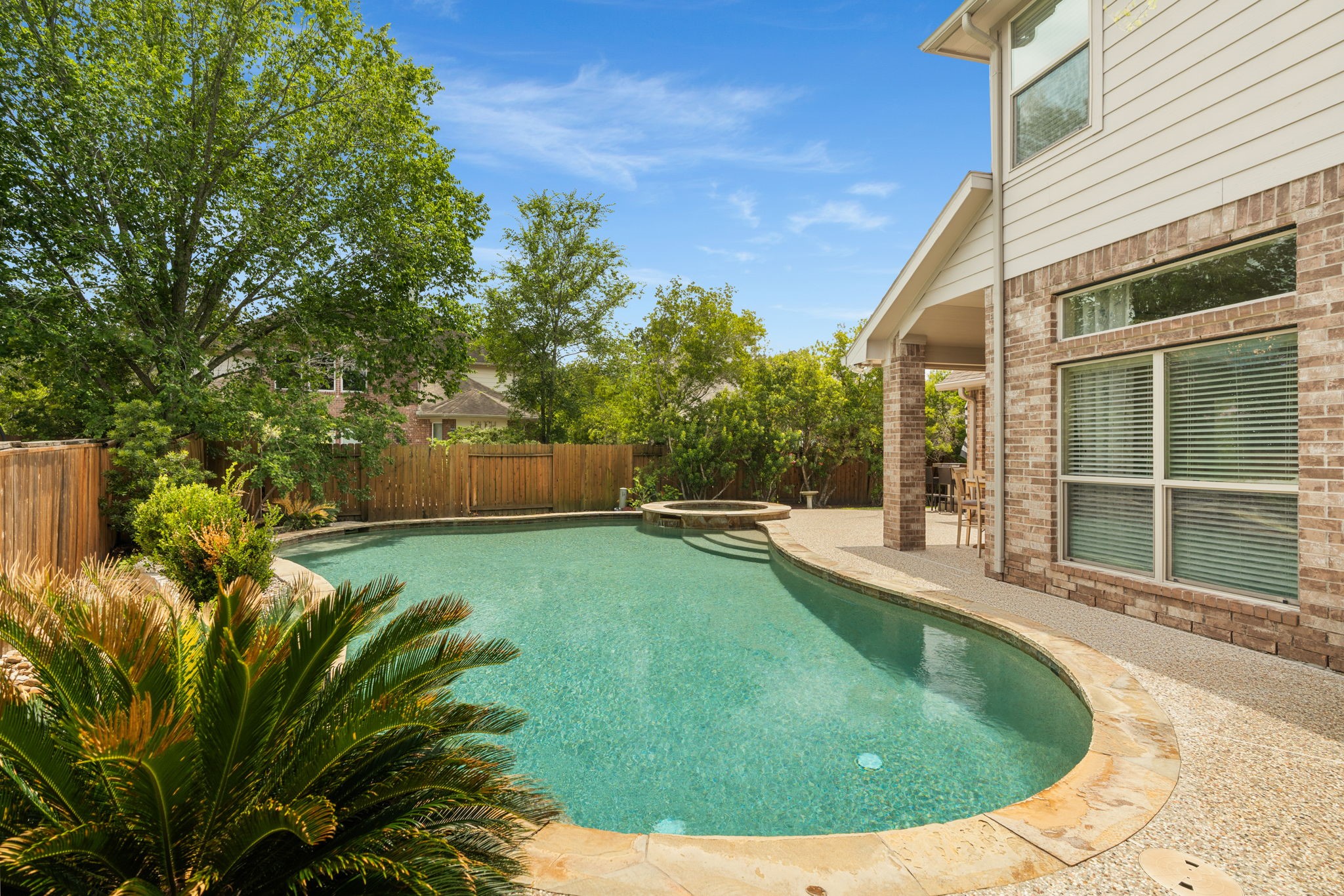 11 Pintuck Place Spring, TX 77389 - Photo 33 of 40 a view of a backyard with swimming pool