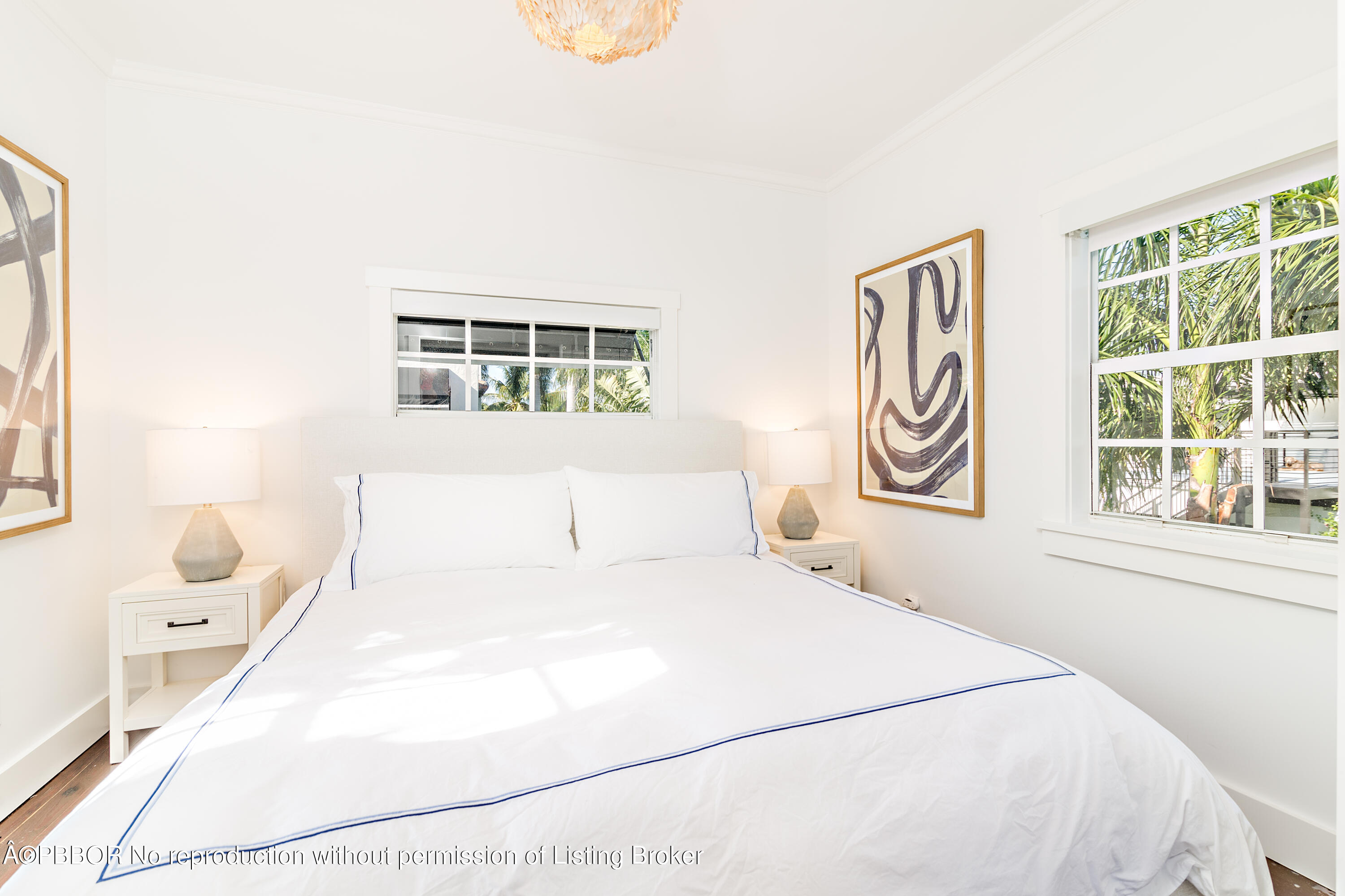 231 Sunset Road West Palm Beach, FL 33401 - Photo 17 of 22 a bedroom with a bed and a window