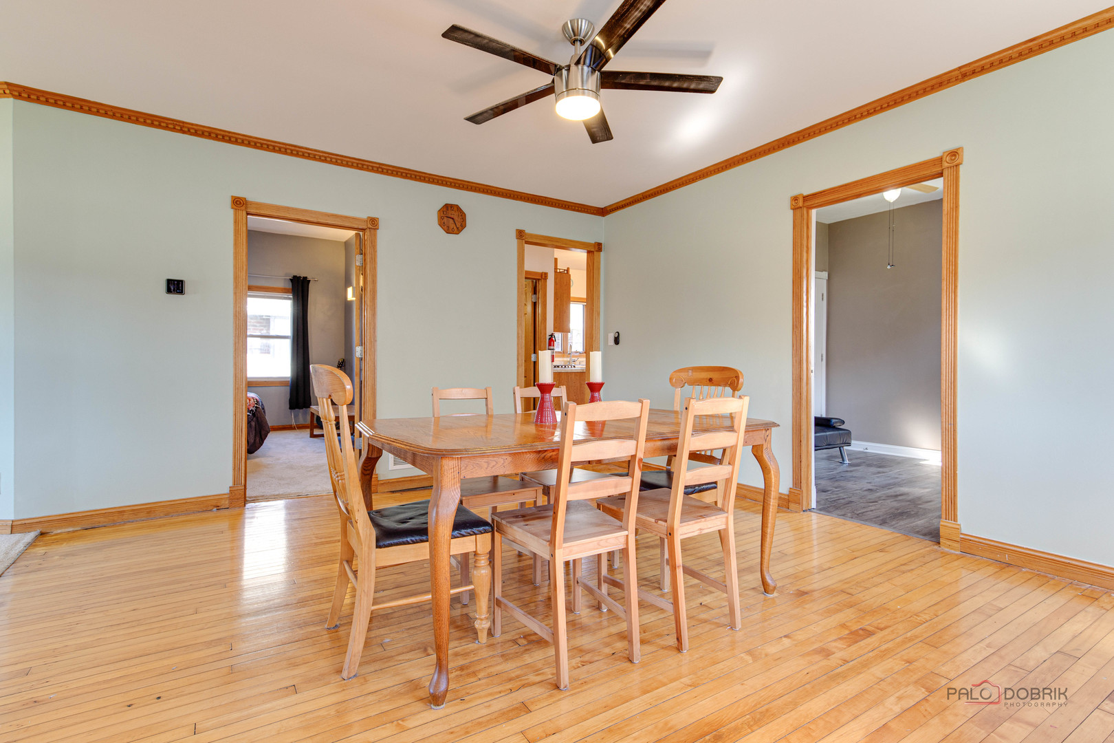 811 Black Road Joliet, IL 60435 - Photo 5 of 29 a dining room with furniture a chandelier and wooden floor