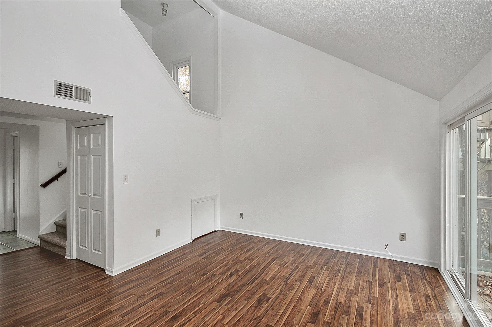 27051 Catamaran Drive Tega Cay, SC 29708 - Photo 20 of 35 a view of empty room with wooden floor and fan