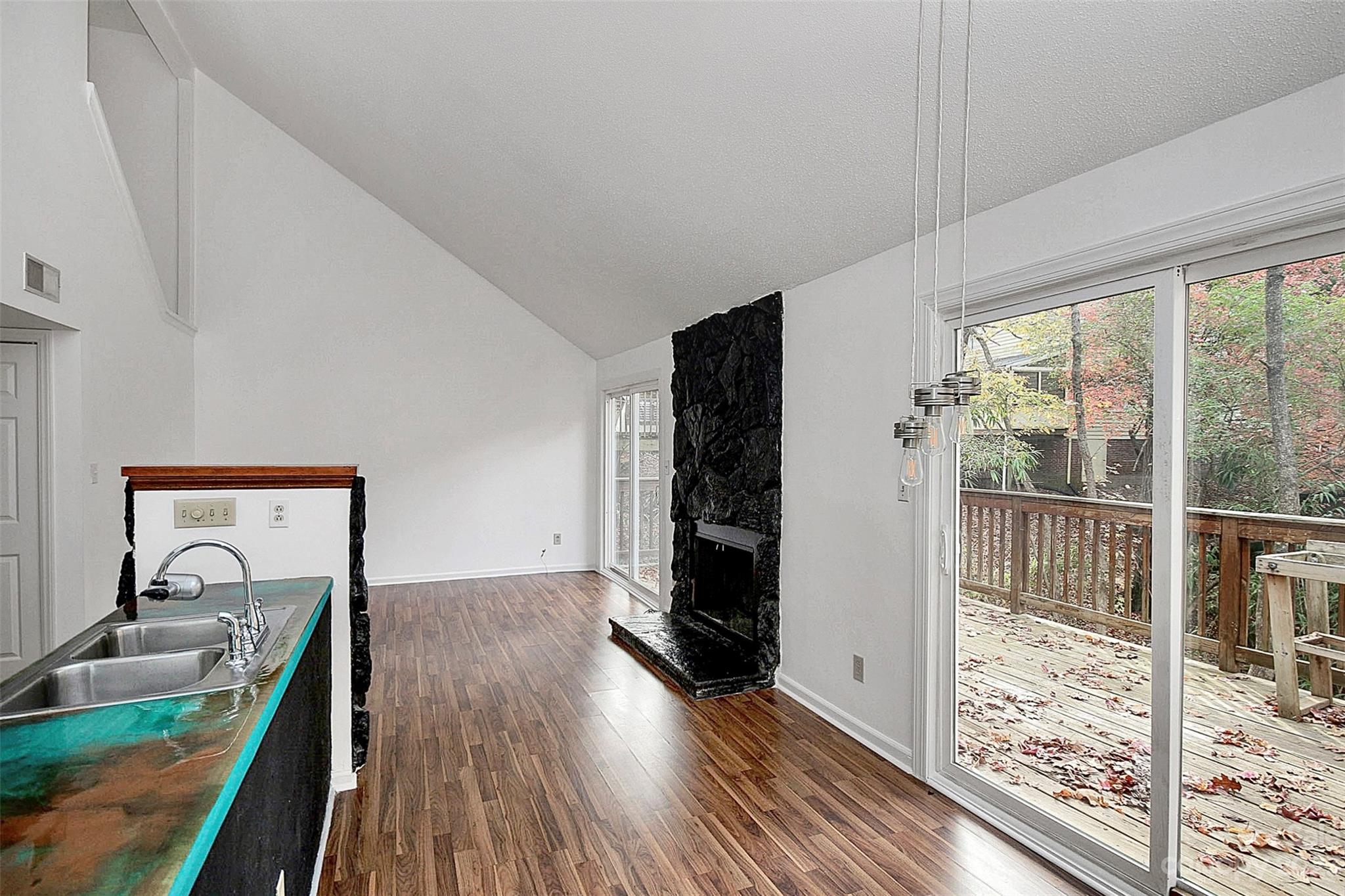 27051 Catamaran Drive Tega Cay, SC 29708 - Photo 25 of 35 a view of a bedroom with wooden floor and a window