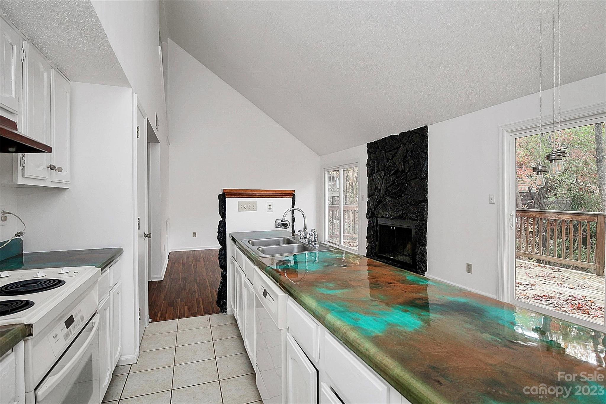 27051 Catamaran Drive Tega Cay, SC 29708 - Photo 29 of 35 a kitchen with stainless steel appliances granite countertop a sink and a stove