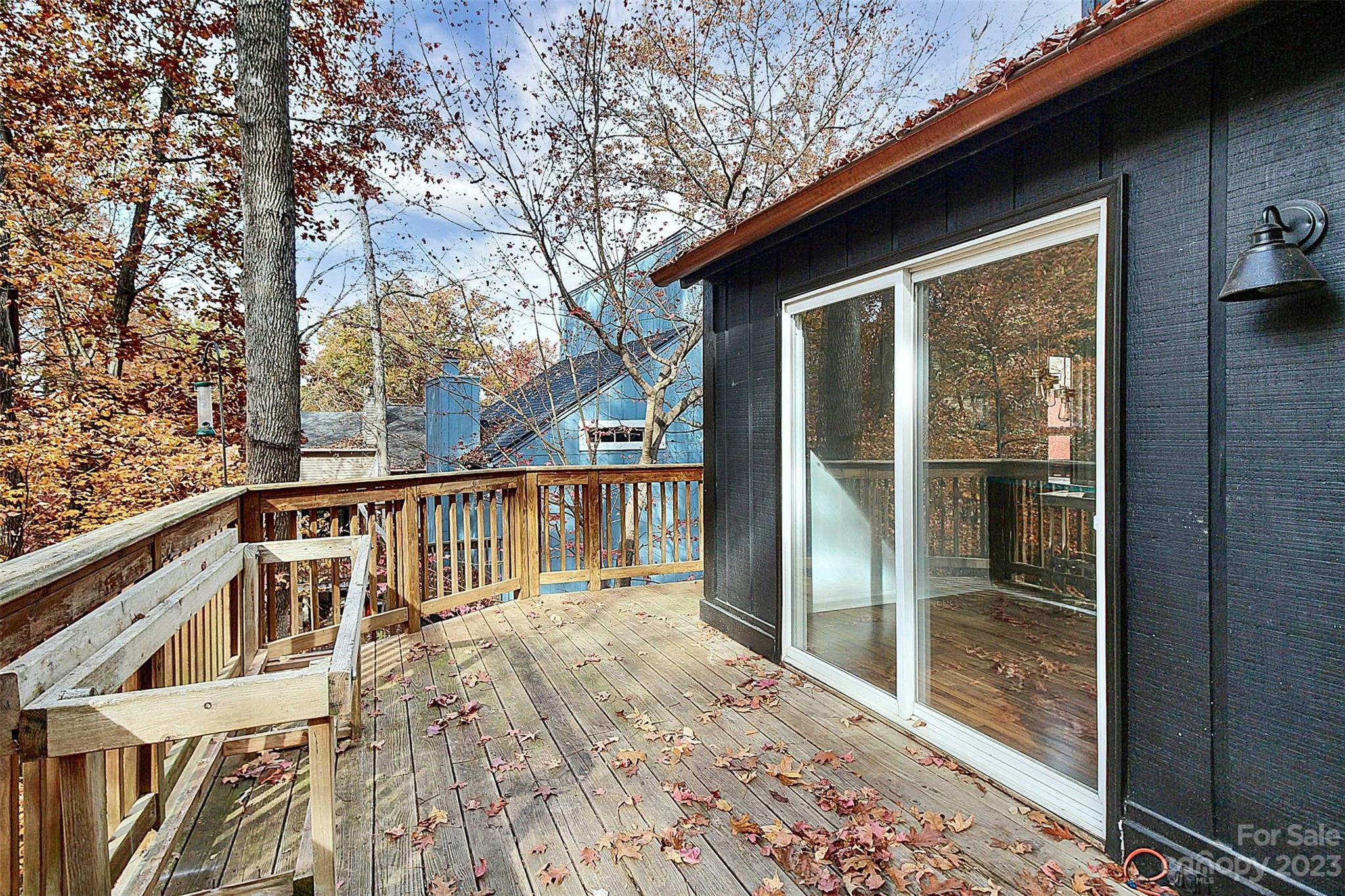 27051 Catamaran Drive Tega Cay, SC 29708 - Photo 33 of 35 a view of balcony with floor to ceiling window and wooden fence