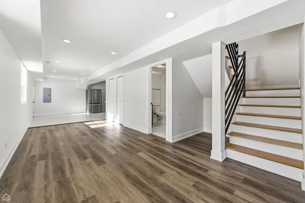 a view of entryway with wooden floor