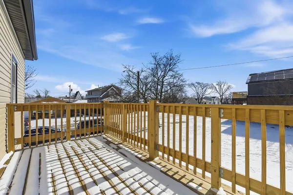 a view of a balcony with wooden floor