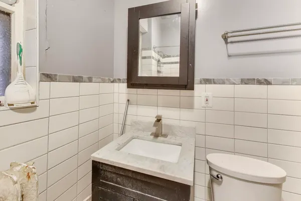 a bathroom with a bathtub and shower