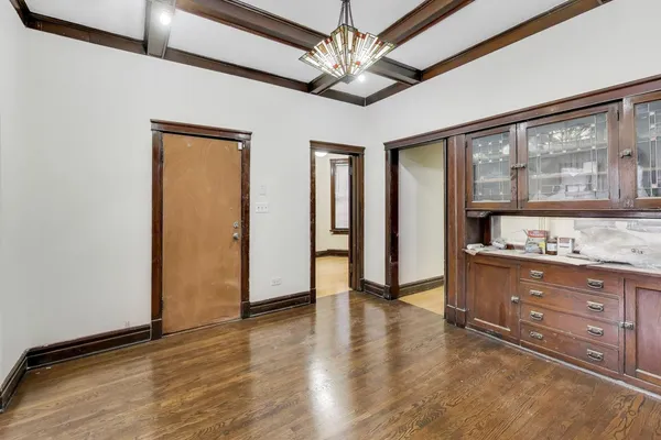 a kitchen with granite countertop a stove and a refrigerator