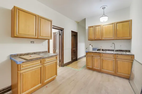 a bathroom with a sink and a window