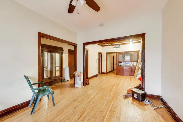 a view of a room with wooden floor