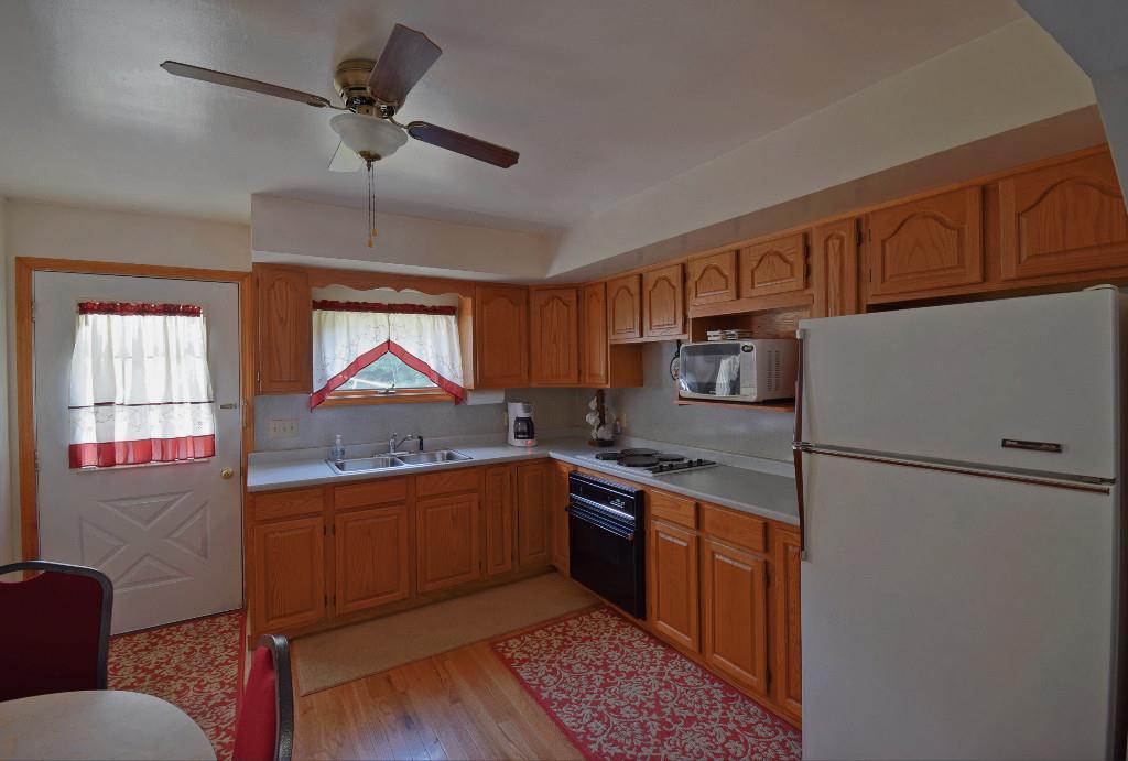 480 Bunker Hill Road Lagrange, ME 04453 - Photo 4 of 23 Kitchen with hardwood floors
