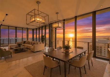 a view of a dining room with furniture window and outside view