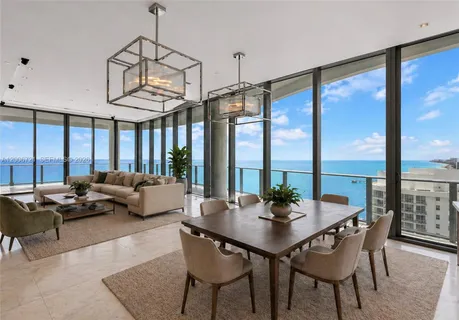 a view of a dining room with furniture window and outside view