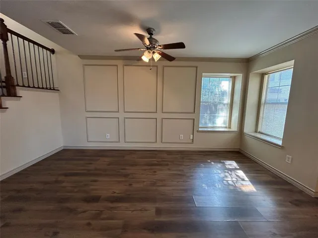 a view of kitchen with cabinets and wooden floor