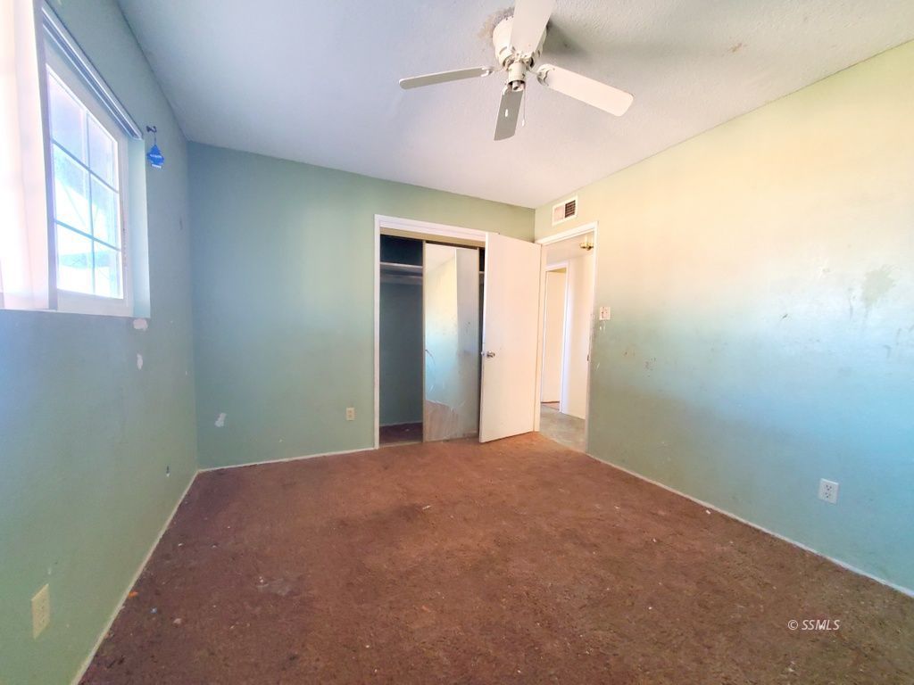 404 Lenore Street Ridgecrest, CA 93555 - Photo 12 of 30 a view of empty room with ceiling fan