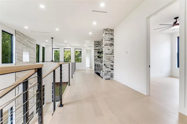 an empty room with windows and entrance