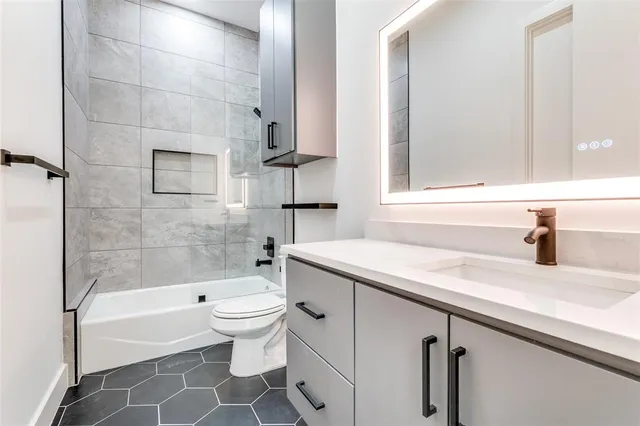 a bathroom with a sink a toilet and a bathtub