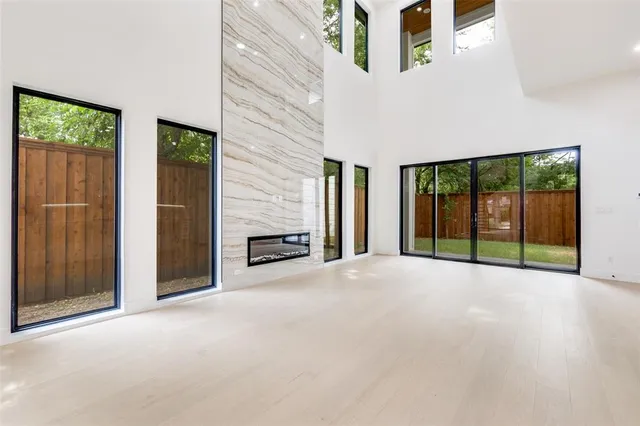 a view of an empty room with windows