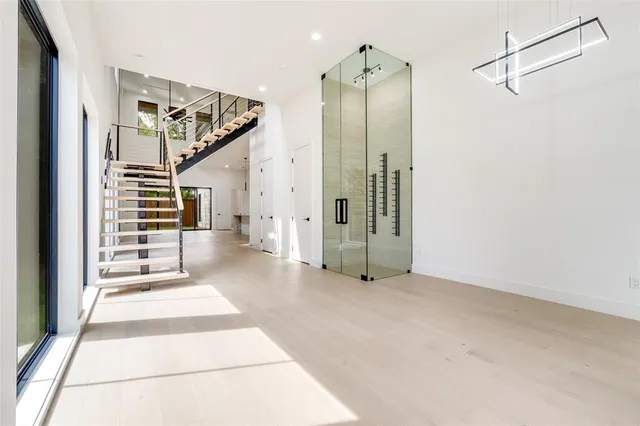 a view of a hallway with closet and entryway