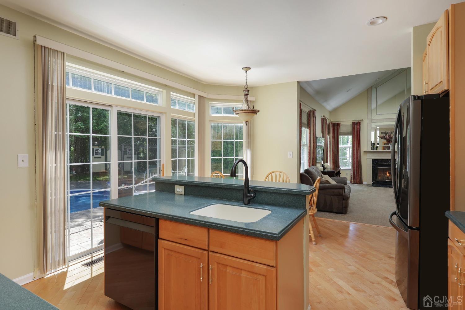 7 Yardley Manor Drive Old Bridge, NJ 07747 - Photo 7 of 23 a view of living room with granite countertop furniture and a fireplace