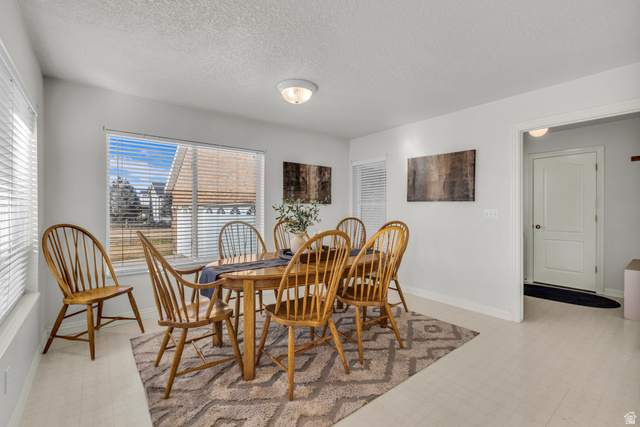 1060 West 2620th Street South Mapleton, UT 84664 - Photo 19 of 87 Dining area with light floors and a textured ceiling