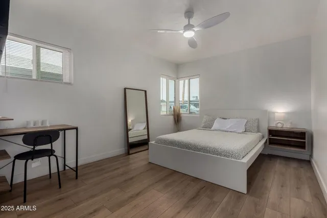 a bedroom with a bed and a table in it