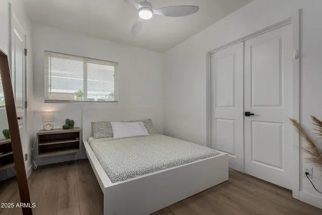 a bedroom with a bed and a window