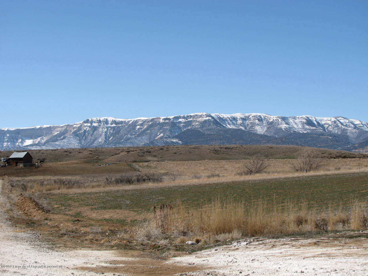 293 County Road 293, Unit LOT 3 Rifle, CO 81650 - Photo 5 of 5 a view of a lake with a mountain in the background