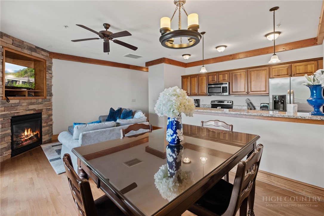 142 Evening View Lane, Unit CA3 Boone, NC 28607 - Photo 11 of 41 a kitchen with a dining table and chairs