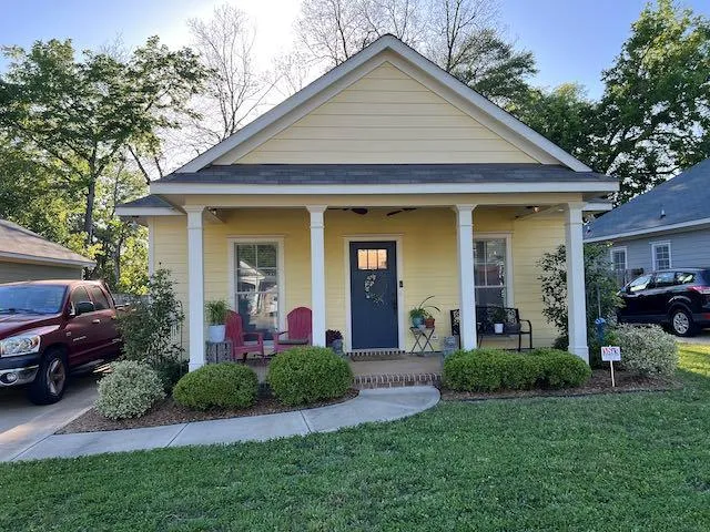 a front view of a house with a yard