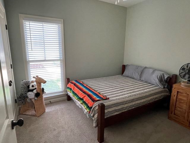 3619 4th Avenue Columbus, GA 31904 - Photo 3 of 4 a bedroom with a bed and a window