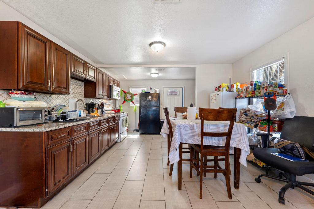 5309 Prock Lane Austin, TX 78721 - Photo 14 of 19 a large kitchen with lots of furniture and appliances