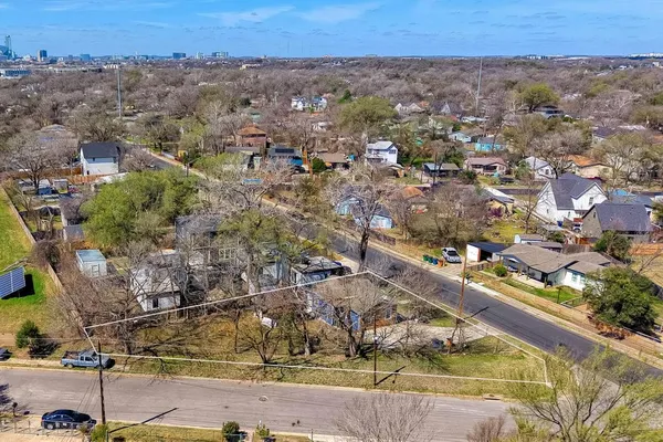 an aerial view of a residential houses and city street