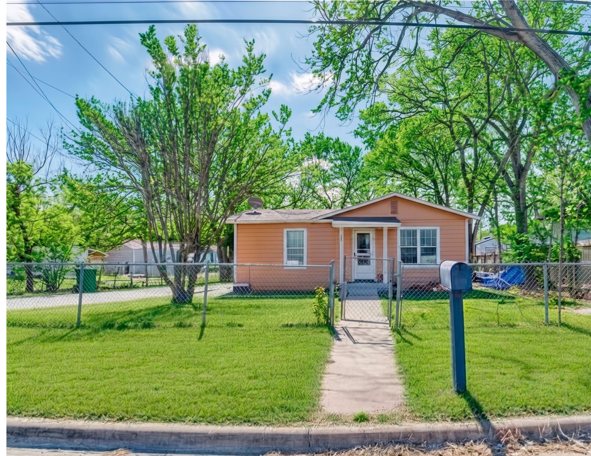 5309 Prock Lane Austin, TX 78721 - Photo 3 of 19 a front view of a house with garden