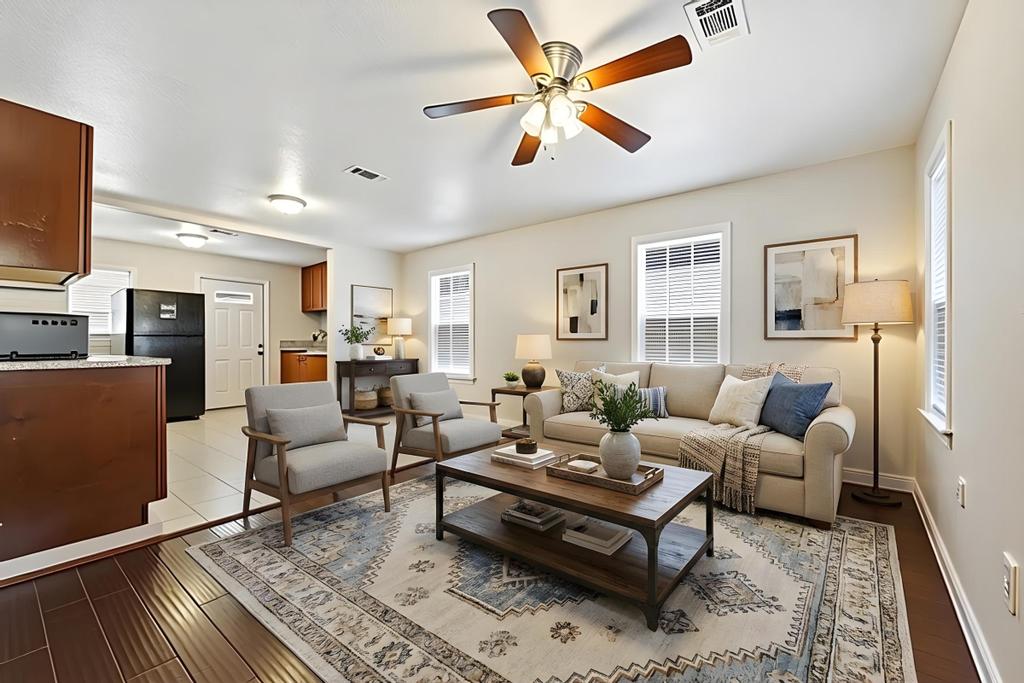 5309 Prock Lane Austin, TX 78721 - Photo 6 of 22 a living room with furniture a rug and a flat screen tv