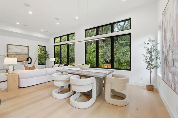 a living room with furniture and a large window with outer view