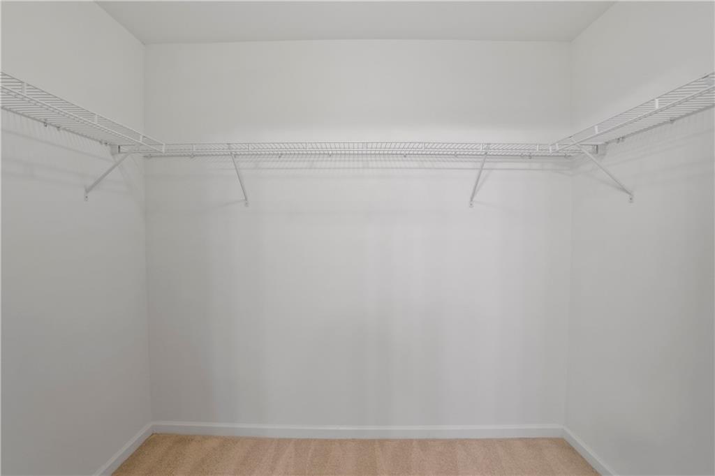 7725 Rutgers Circle Fairburn, GA 30213 - Photo 18 of 20 a view of a room with racks on the wall