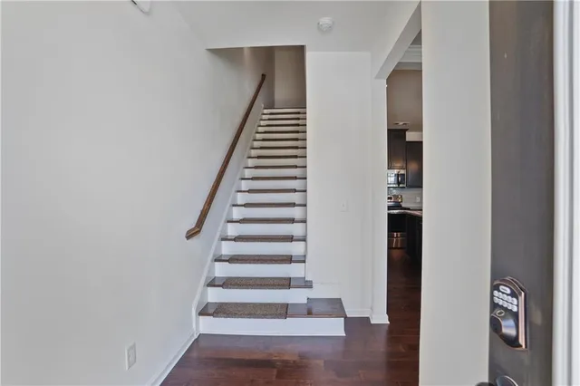 a view of an entryway with wooden floor