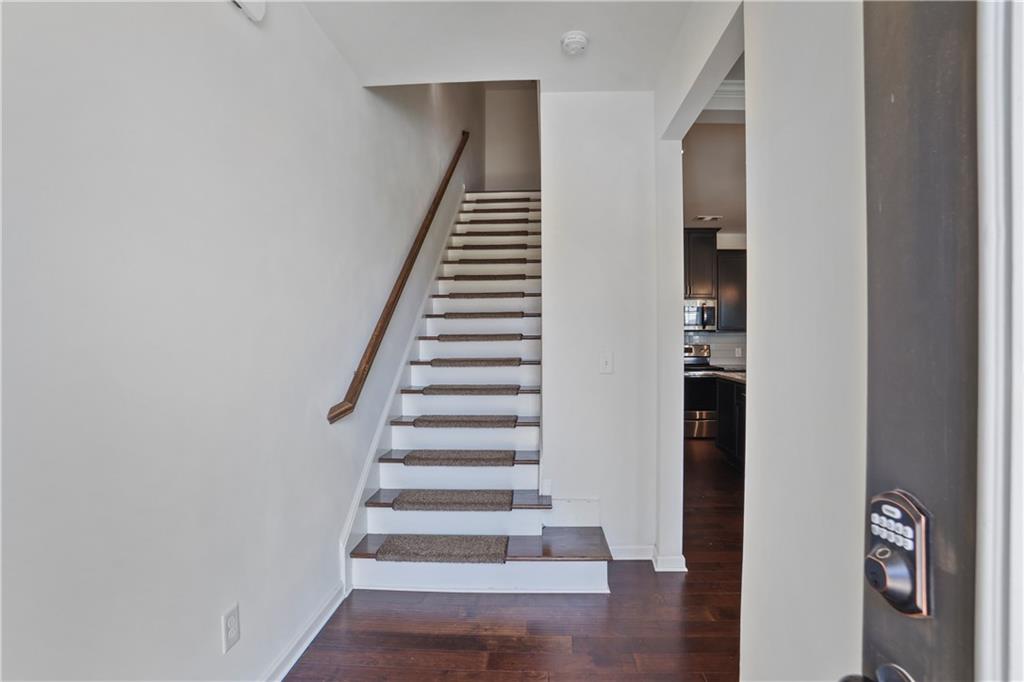 7725 Rutgers Circle Fairburn, GA 30213 - Photo 2 of 20 a view of an entryway with wooden floor
